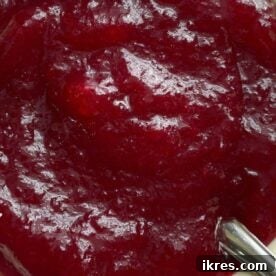 Homemade cranberry sauce with orange juice in a serving bowl.