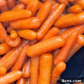 Slow cooker glazed carrots coated in brown sugar, honey, and cinnamon.