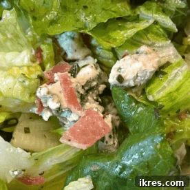 Royal Street Salad with crispy romaine lettuce, bacon, and blue cheese.