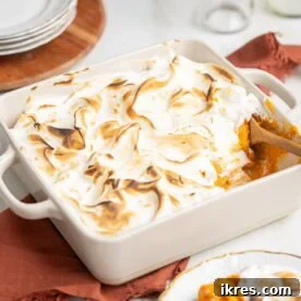 Sweet potato fluff casserole topped with golden, gooey marshmallows.
