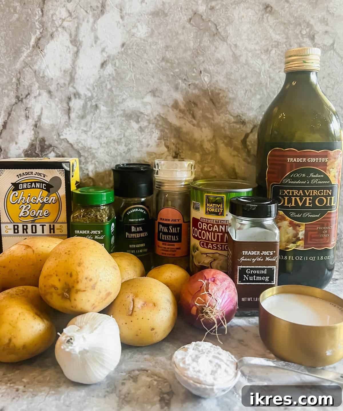 Creamy Dairy Free Scalloped Potatoes Paleo Whole30 Gluten Free 3 Arrangement of fresh potato gratin ingredients including potatoes, garlic, shallots, and various liquids in individual bowls.