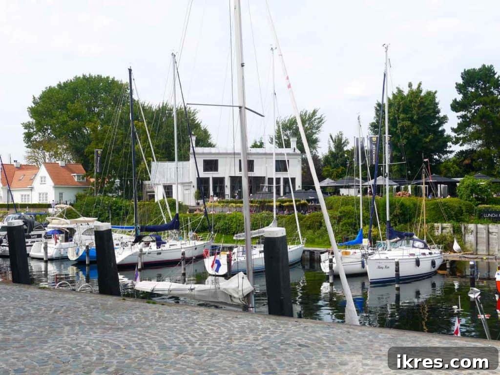 Reflections of Veere's charming houses on the calm water