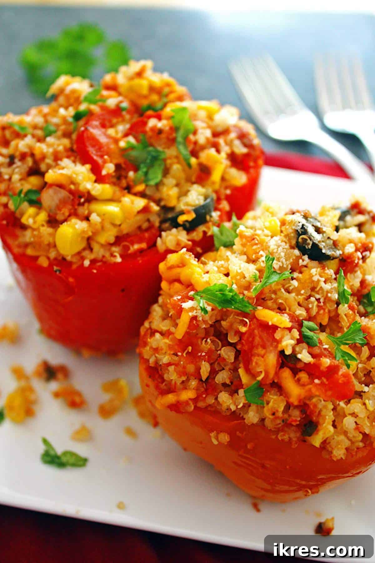 Comforting Crockpot Stuffed Peppers 2 Delicious Crockpot Stuffed Peppers ready to be served, filled with quinoa, vegetables, and cheese.