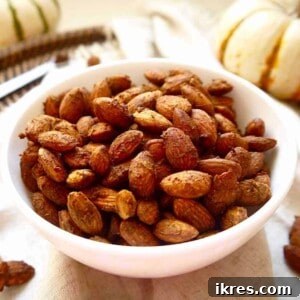 A smaller image of pumpkin spice almonds in a bowl, accompanying the recipe card for easy reference.