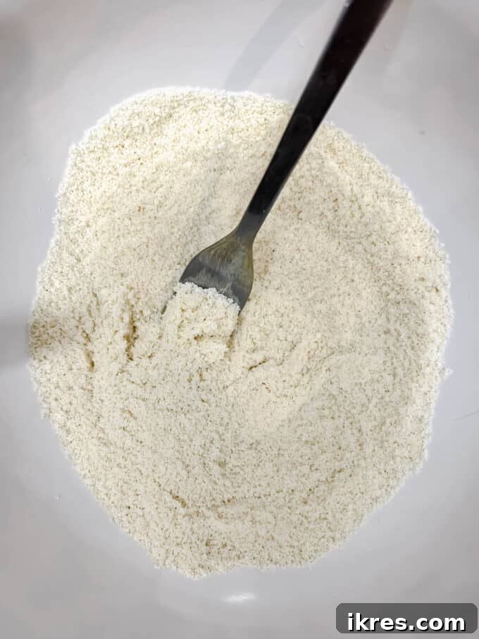 Almond flour, baking soda, and salt mixed in a separate bowl for dry ingredients.
