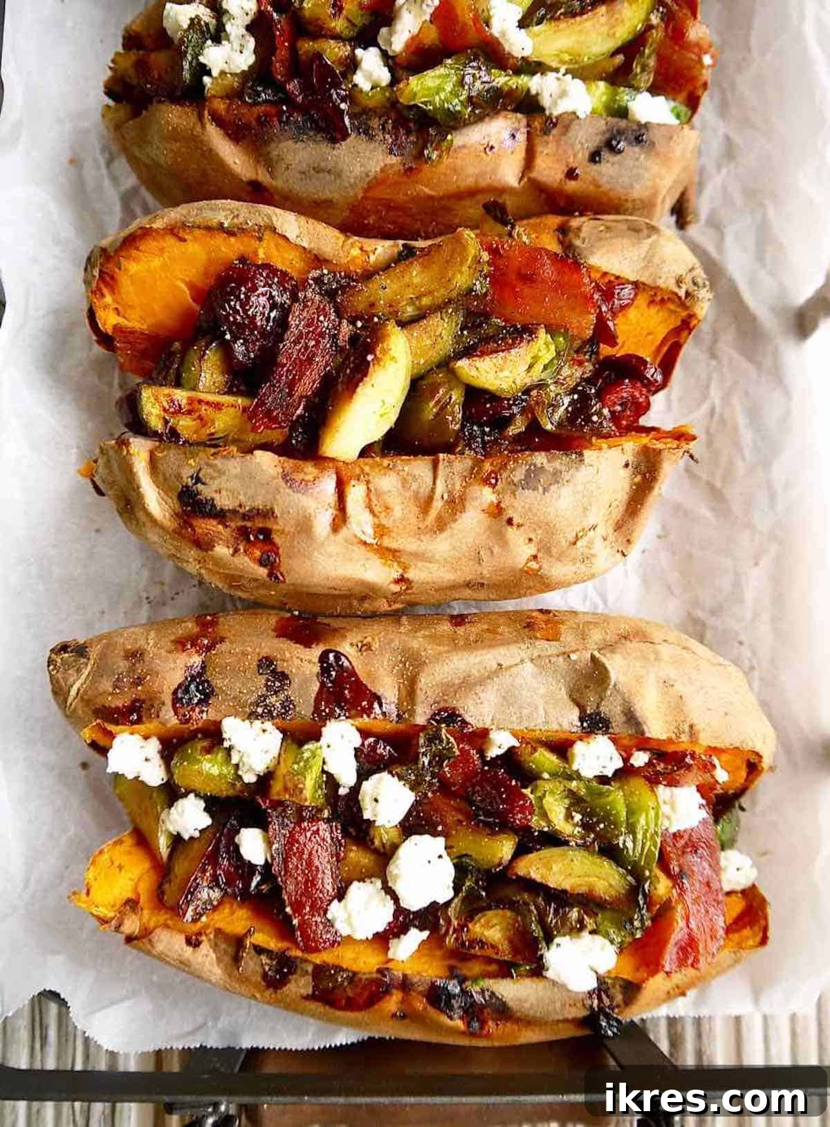Sweet Potato Boats: Bacon, Brussels & Cranberry 5 Beautifully baked sweet potatoes, cut open and generously stuffed with a savory and sweet mixture of maple bacon Brussels sprouts and cranberries, finished with goat cheese crumbles.
