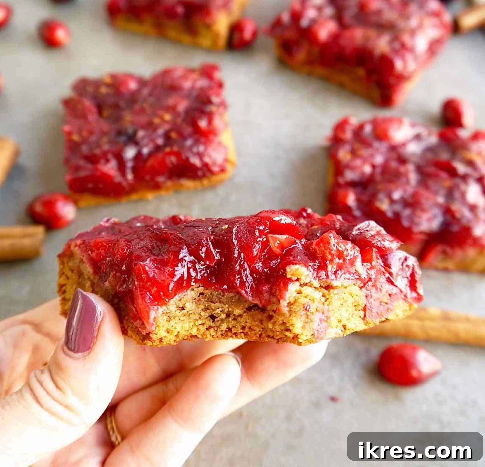 Paleo cranberry sauce bars cut into neat squares, ready for serving.