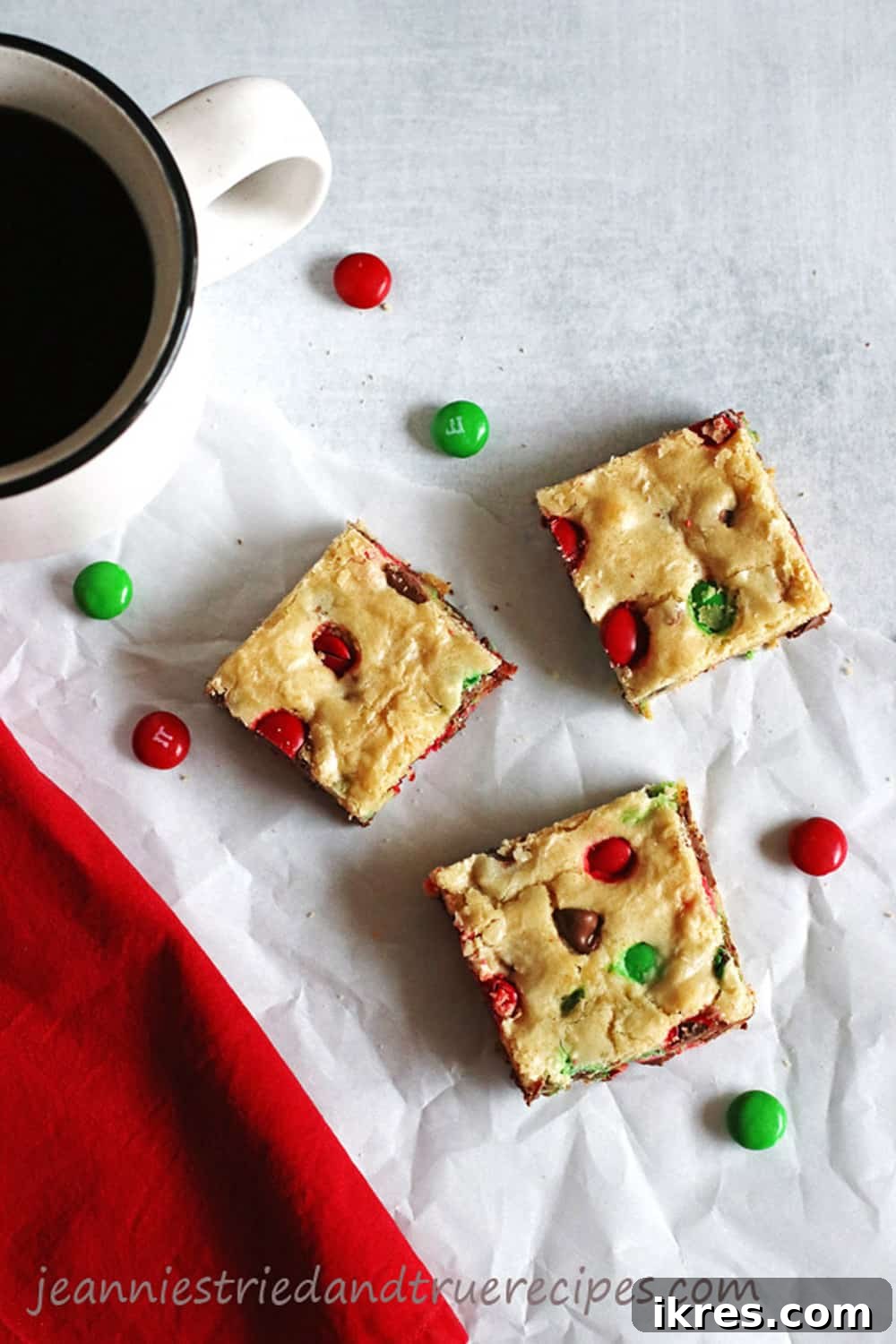 Decadent Cookie Squares 6 M&M Cookie Bars cut into perfect squares, served with a cup of coffee, ready to enjoy.