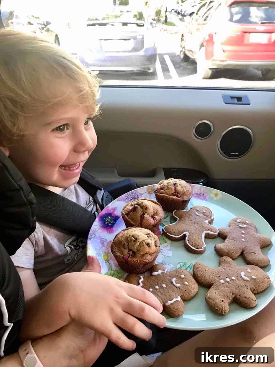 Toddler enjoying gingerbread men cookies.