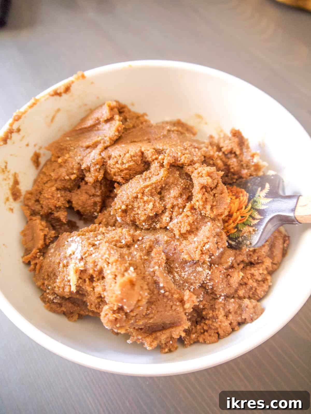 Gingerbread men dough in a bowl.