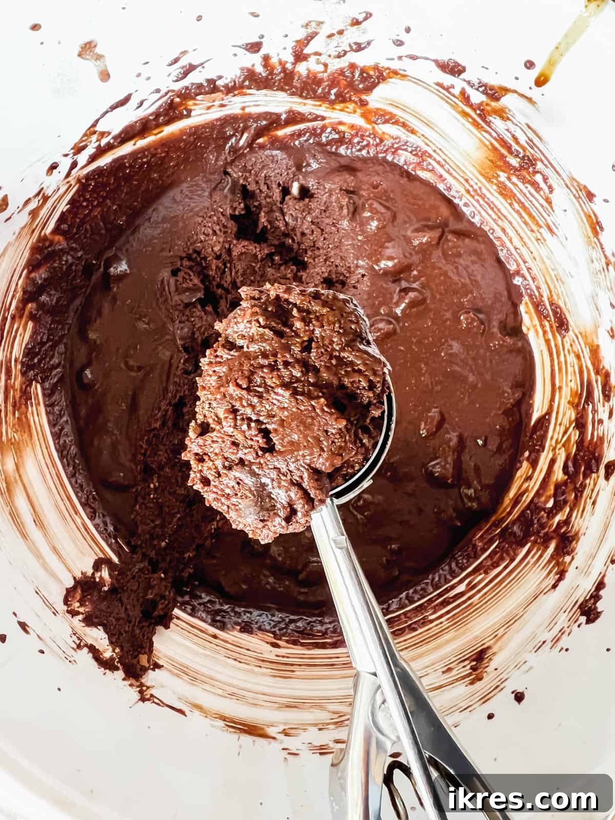 Decadent Paleo Gluten-Free Double Chocolate Chip Cookies 8 Chilled paleo double chocolate chip cookie dough covered with plastic wrap in a bowl.