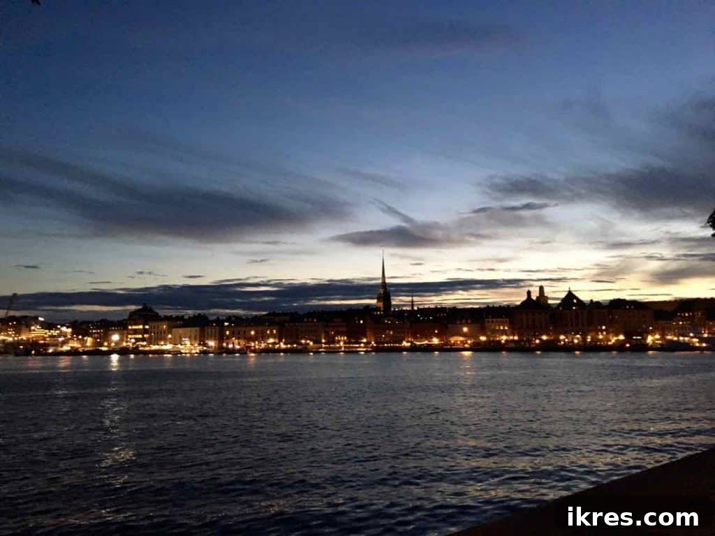 Stockholm: Sweden's Midnight Sun Capital 19 A stunning nighttime cityscape of Stockholm, with illuminated buildings and reflections on the water.