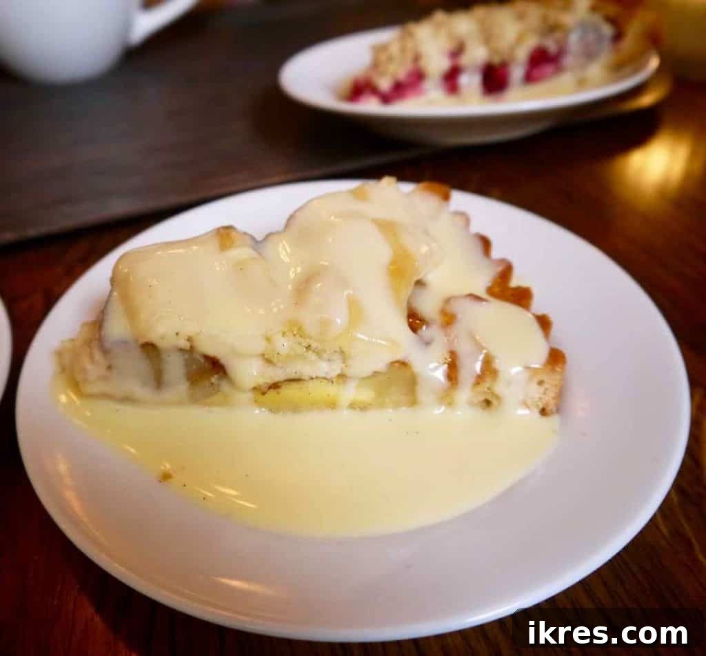 Stockholm: Sweden's Midnight Sun Capital 25 A delicious apple pie generously topped with cream, alongside other fika treats, at Cafe Kronan.