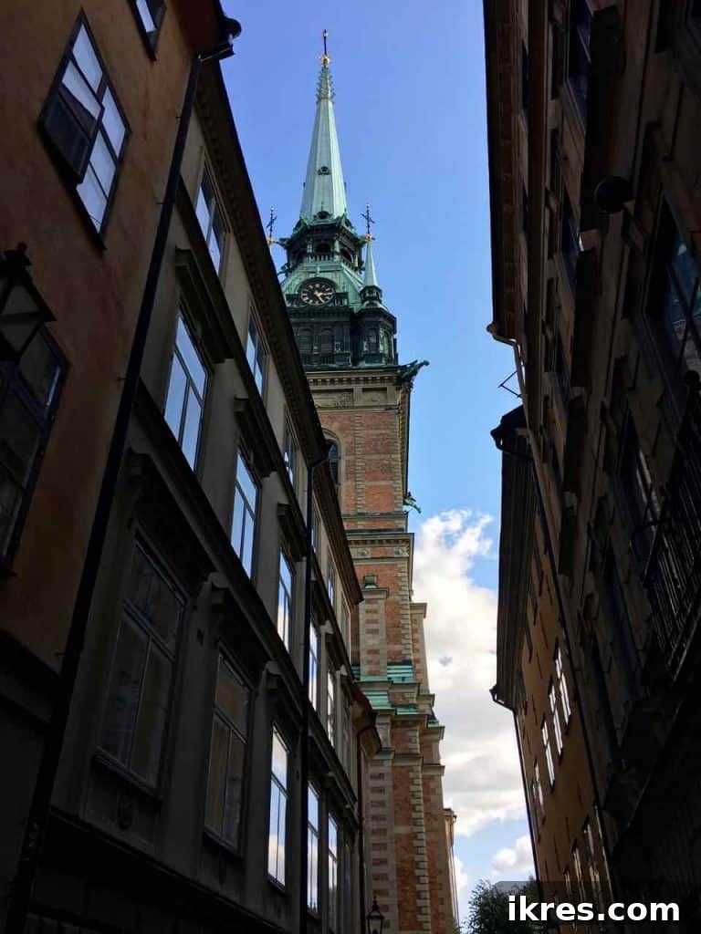 Stockholm: Sweden's Midnight Sun Capital 5 A quaint narrow alleyway in an old European city, inviting exploration with its historic charm.