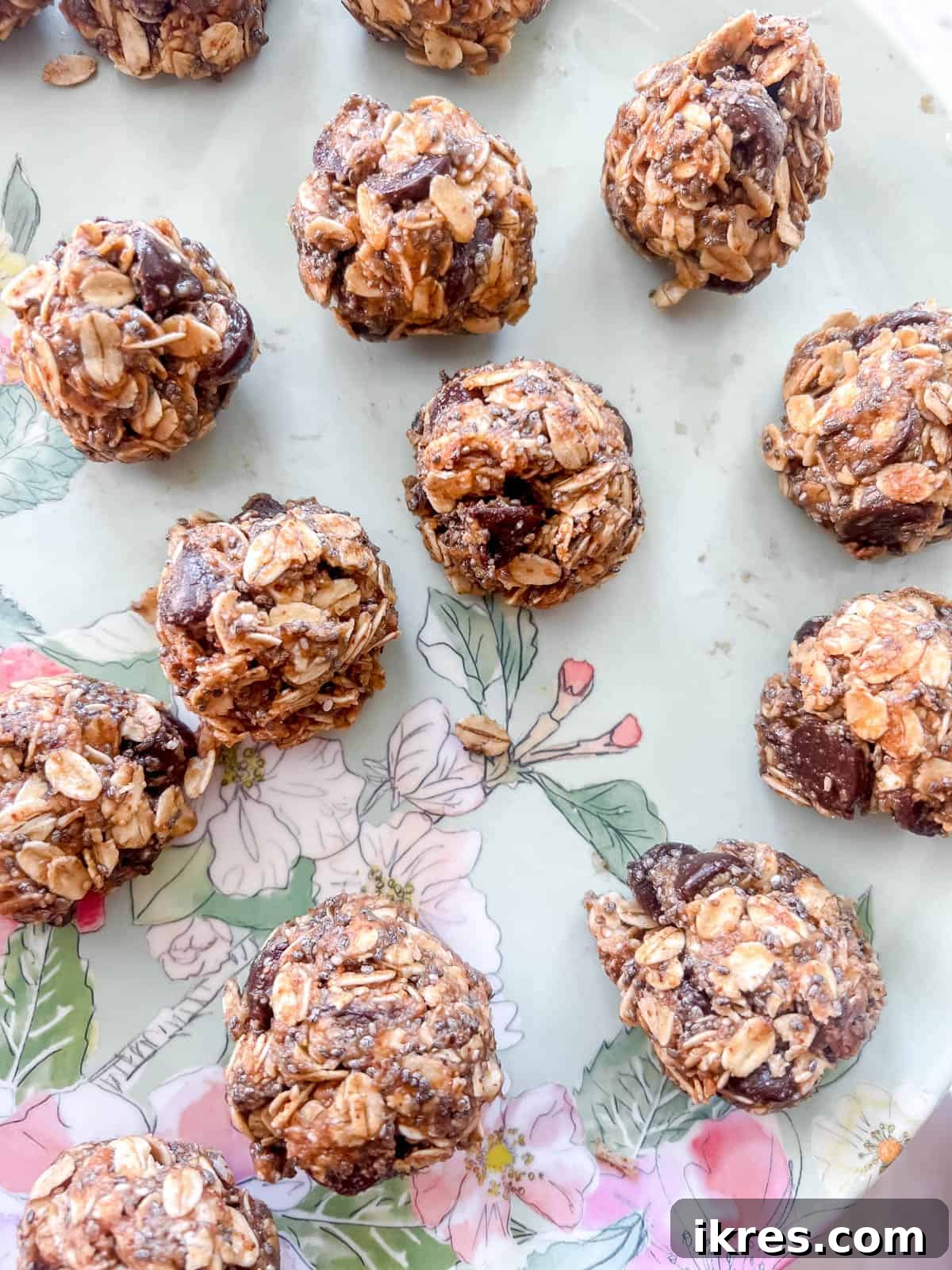 Chocolate Chip Chia Oatmeal Power Bites 7 Energy balls rolled into balls and on a plate.