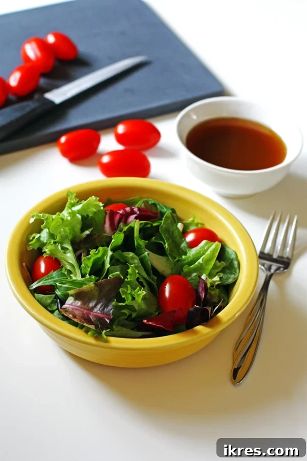 Easy Homemade Balsamic Vinaigrette 2 Freshly made Balsamic Vinaigrette in a glass jar, showcasing its rich color and ready for use.