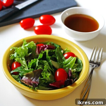 Balsamic Vinaigrette in a glass cruet, ready to be served.