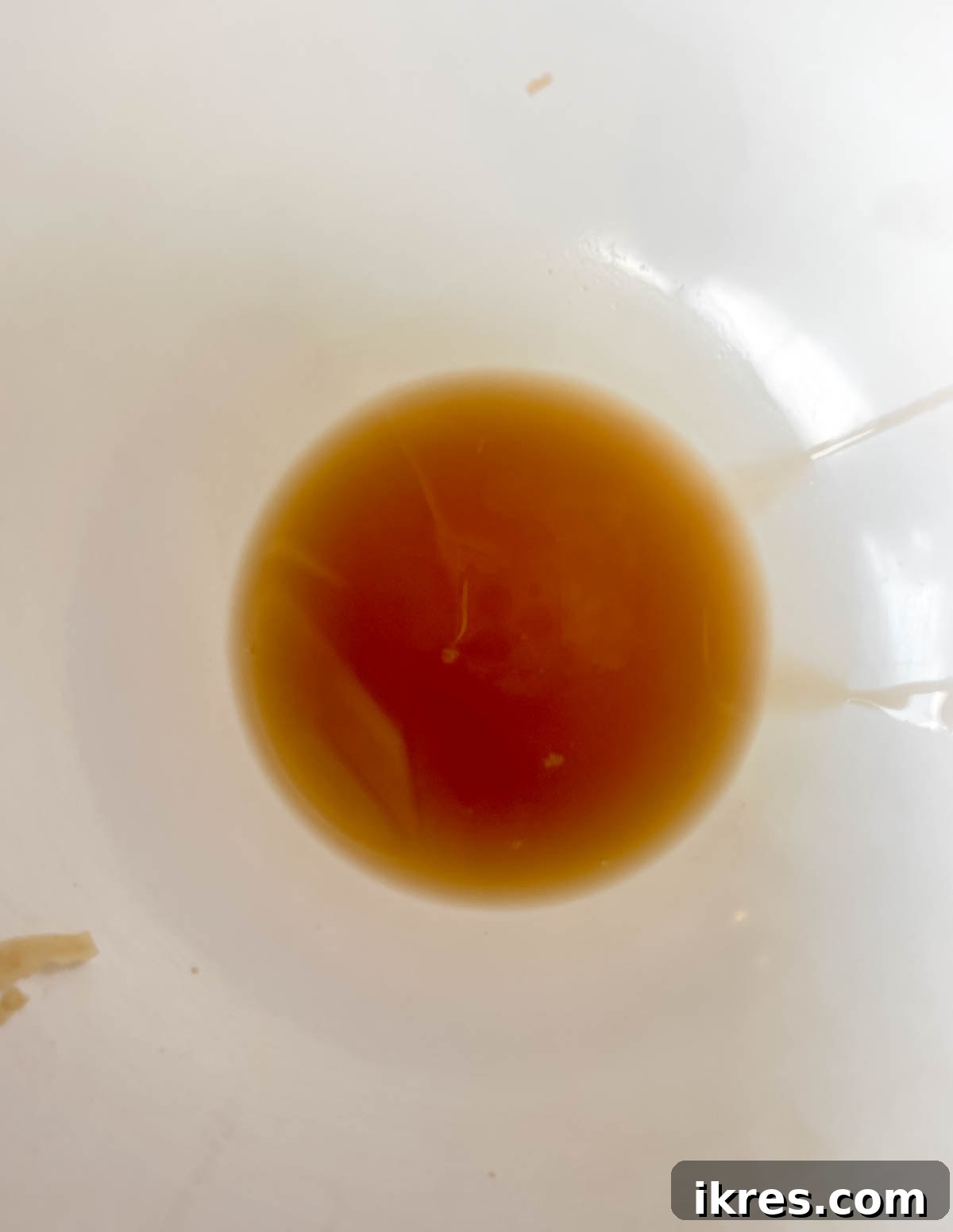 The bowl after the potato water has been drained from the shredded potatoes.
