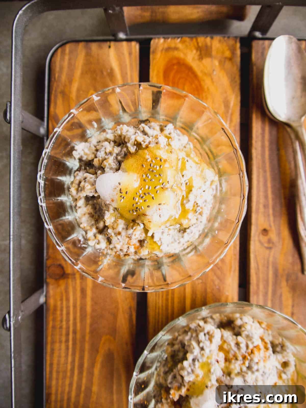 Wholesome Gluten-Free Steel Cut Oats with Chia and Coconut Oil 4 A close-up of a single bowl of steel cut oats, beautifully topped with chia seeds, a drizzle of coconut oil, and a hint of honey, showcasing its inviting texture.