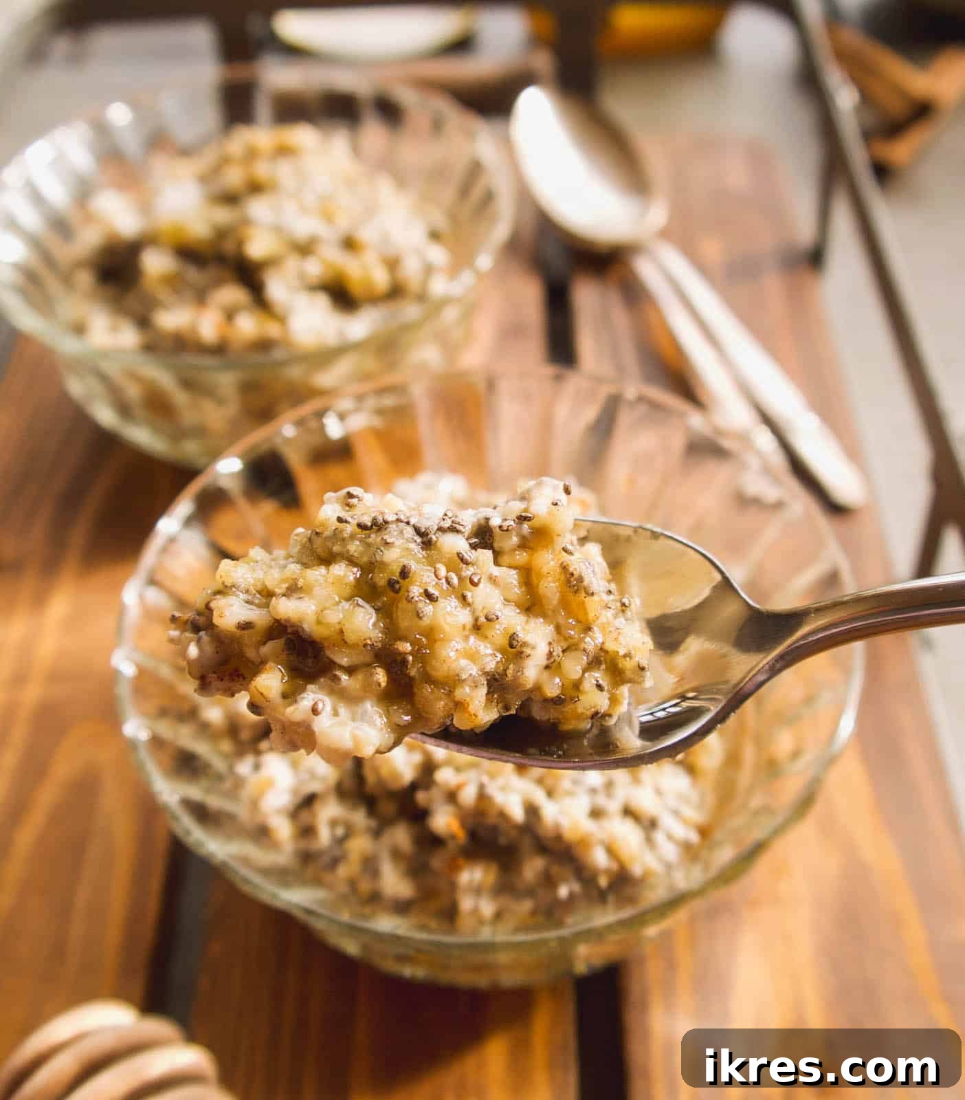 Wholesome Gluten-Free Steel Cut Oats with Chia and Coconut Oil 5 A rustic bowl of gluten-free steel cut oats with chia seeds, drizzled with honey, highlighting the natural goodness and simplicity of the meal.