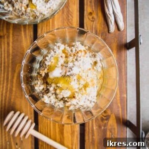 Gluten free steel cut oats recipe in a bowl with honey and chia seeds on top.