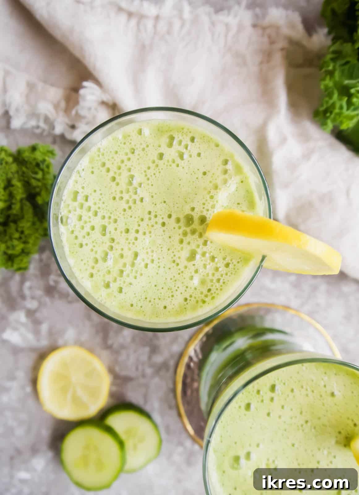 Fennel Ginger Green Elixir 4 Aerial view of a glass of Green Juice with Apple, Kale, Cucumber, Fennel, and Ginger, showcasing its vibrant color and freshness.