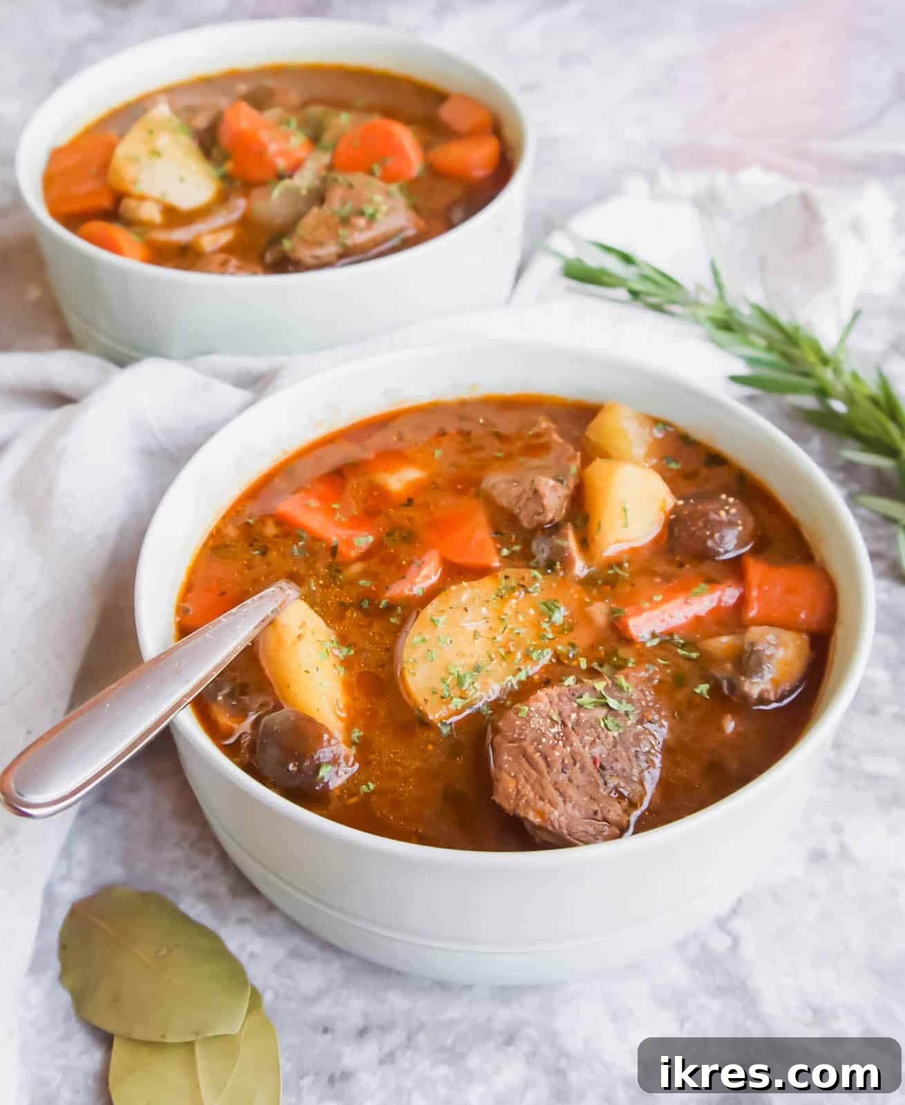 Hearty Slow Cooker Paleo Irish Beef Stew Gluten Free Whole30 3 Paleo Irish stew in a bowl from a side angle.