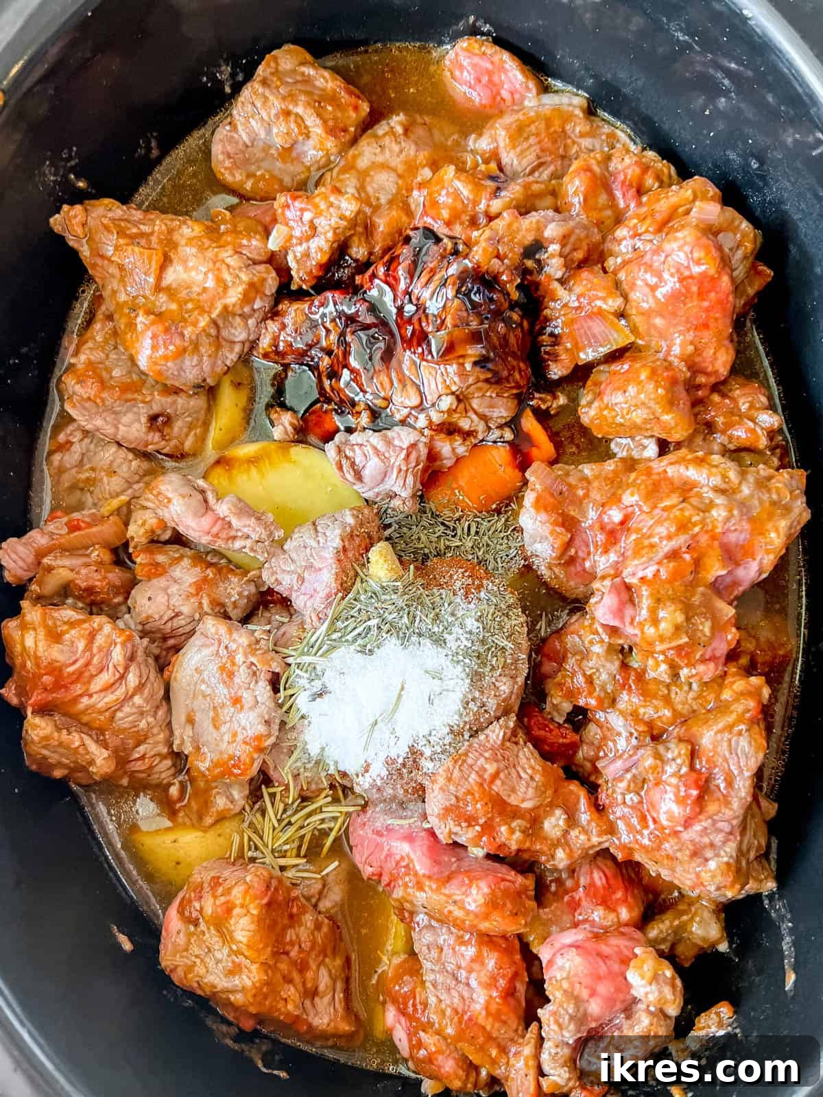 Hearty Slow Cooker Paleo Irish Beef Stew Gluten Free Whole30 7 All of the ingredients in the crock pot before cooking.