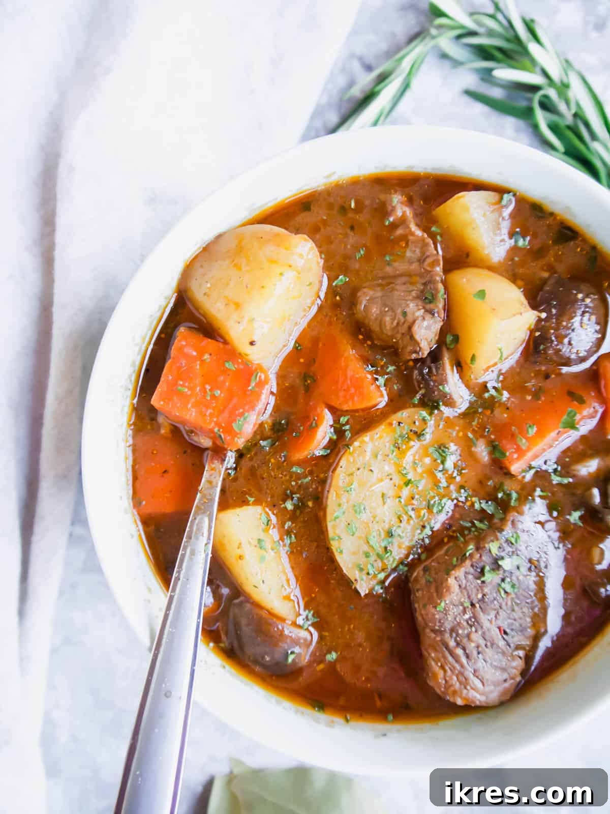 Hearty Slow Cooker Paleo Irish Beef Stew Gluten Free Whole30 9 Whole30 beef stew in a large bowl.