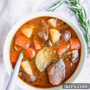 Paleo beef stew in a bowl with a spoon in the bowl.
