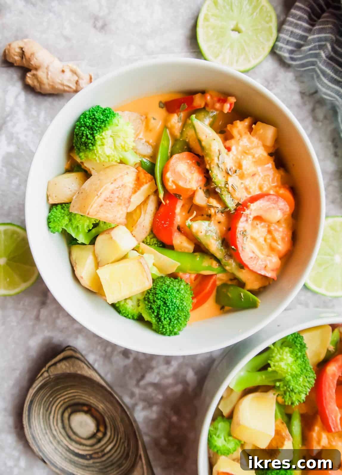 Plant-Based Paleo Thai Red Curry 11 A large, inviting bowl of rich, homemade Thai vegetable red curry, perfectly garnished and ready for a comforting meal.