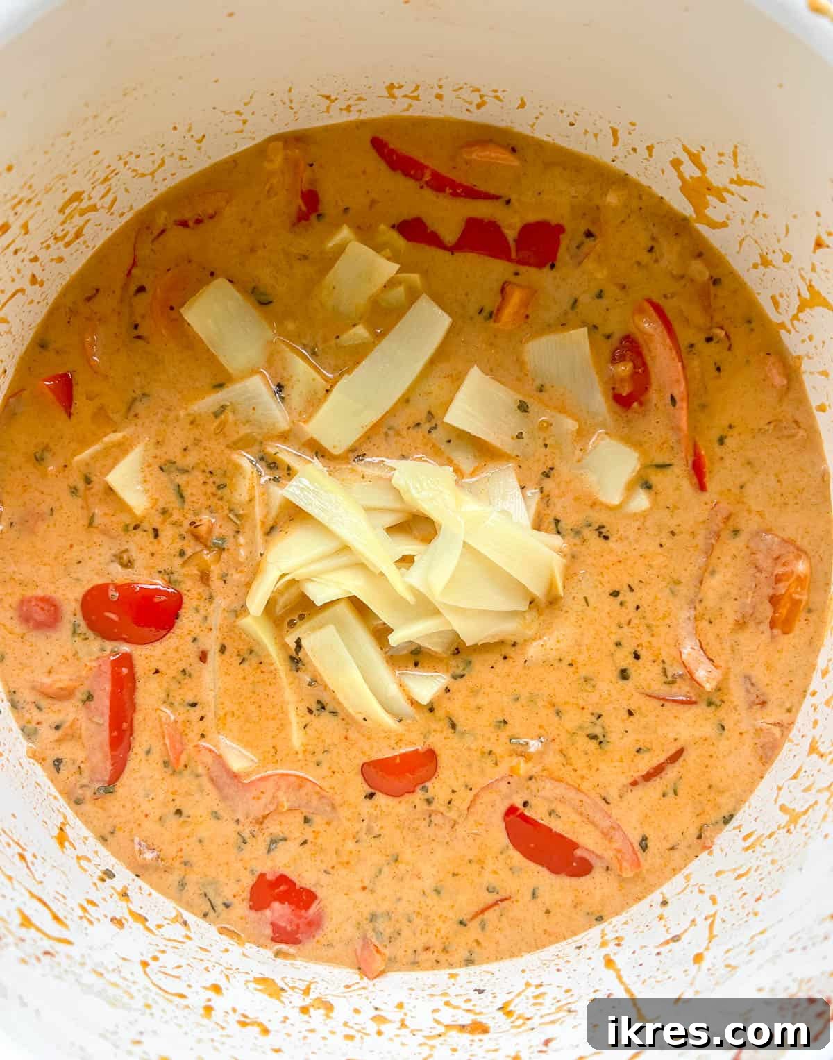Plant-Based Paleo Thai Red Curry 9 Adding crisp bamboo shoots to the bubbling vegan Thai red curry sauce, letting them absorb the rich flavors.