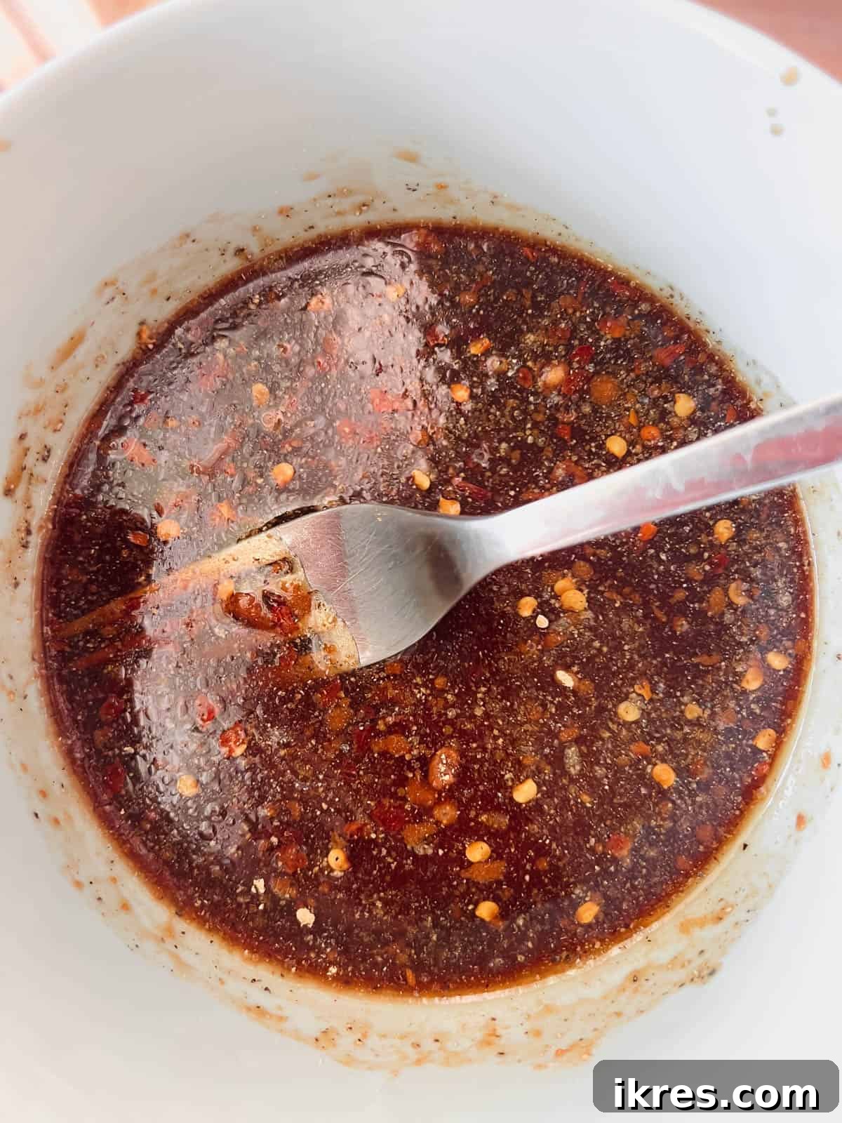 Coconut aminos sauce ingredients mixed in a small bowl.