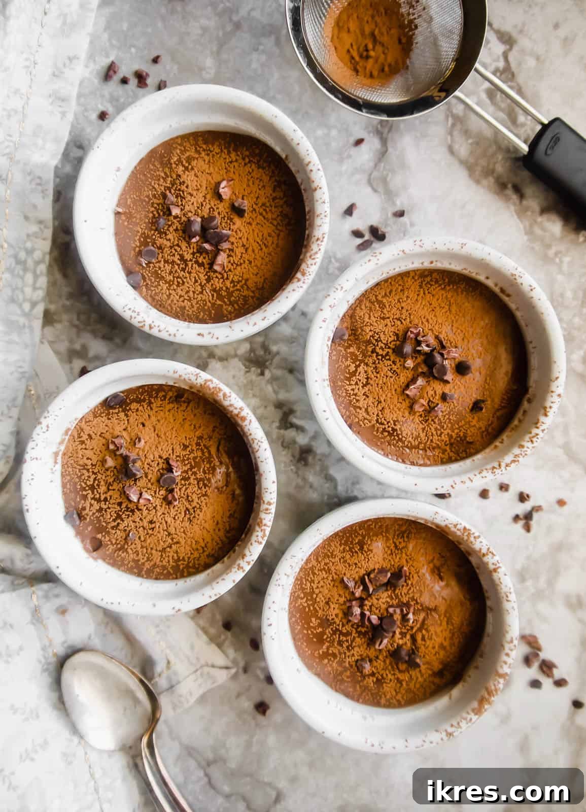 Indulgent Paleo Vegan Chocolate Pudding 3 Paleo chocolate pudding served in small ramekins, ready to be chilled.