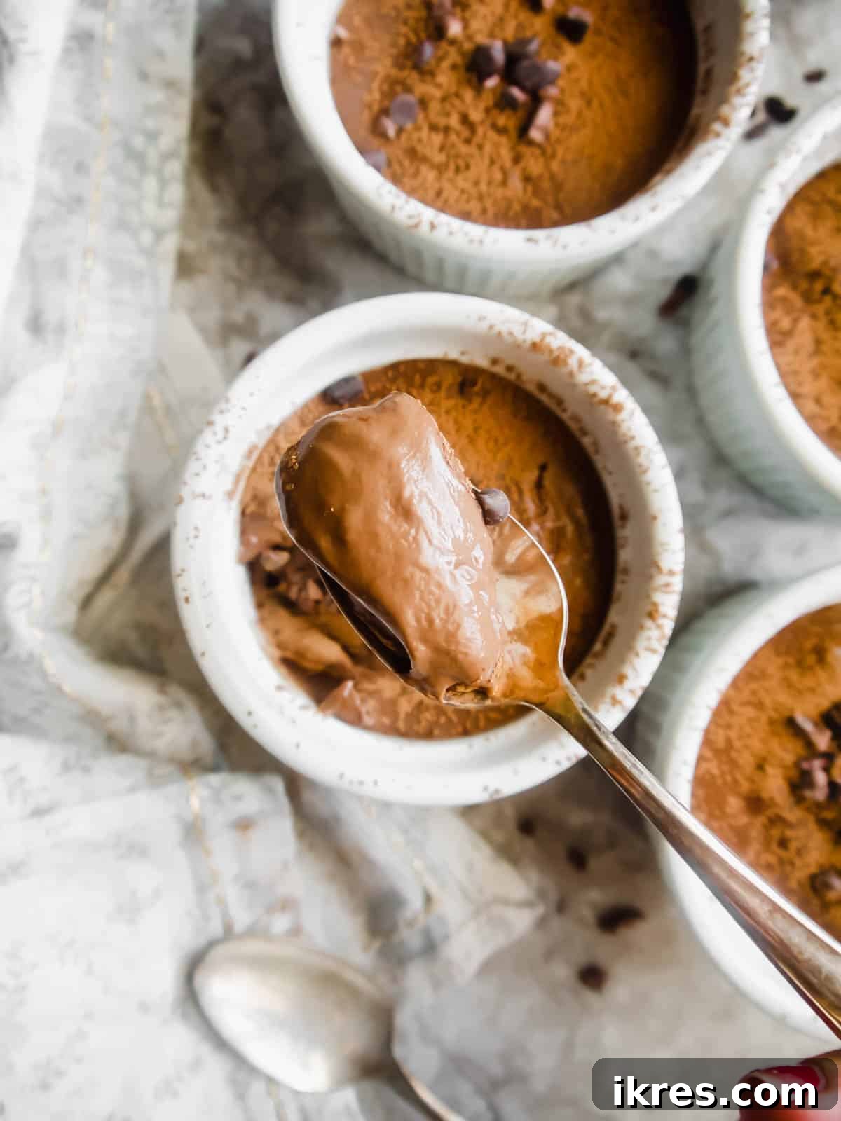 Indulgent Paleo Vegan Chocolate Pudding 5 A spoonful of thick and glossy tapioca flour pudding.