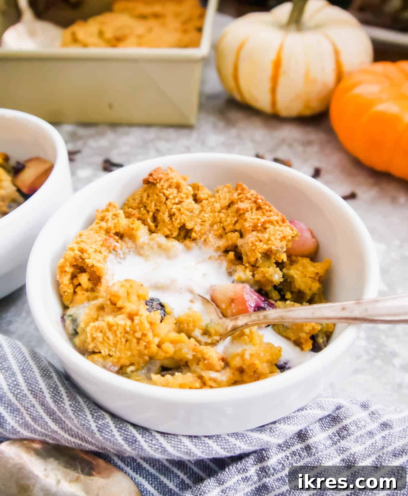 A beautifully baked Gluten-free blueberry cobbler with pears nestled inside, ready to be served.