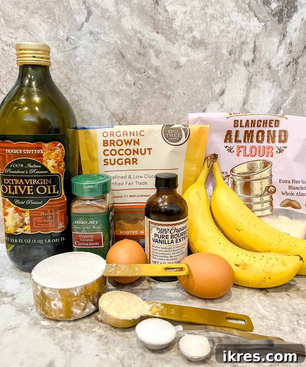 Paleo Banana Bread Grain and Dairy Free 4 Ingredients for paleo banana bread laid out on a surface.