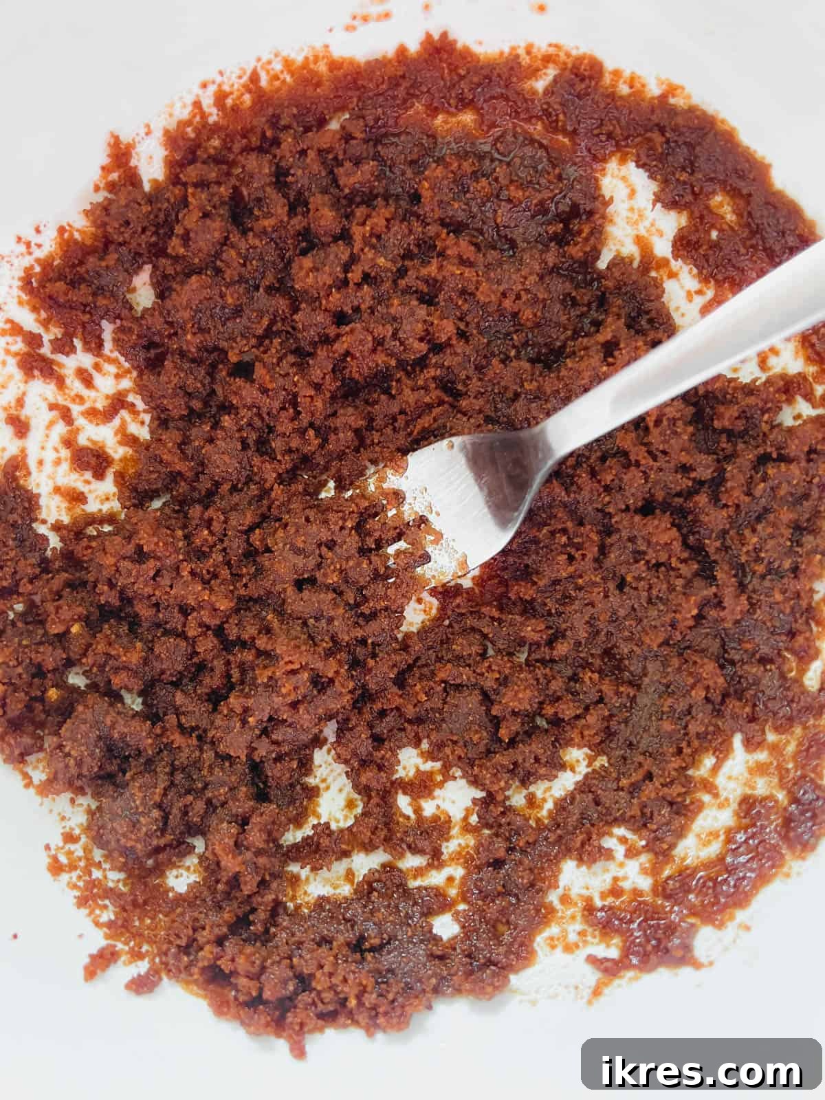 Paleo Banana Bread Grain and Dairy Free 5 Coconut sugar and olive oil being mixed together in a bowl.