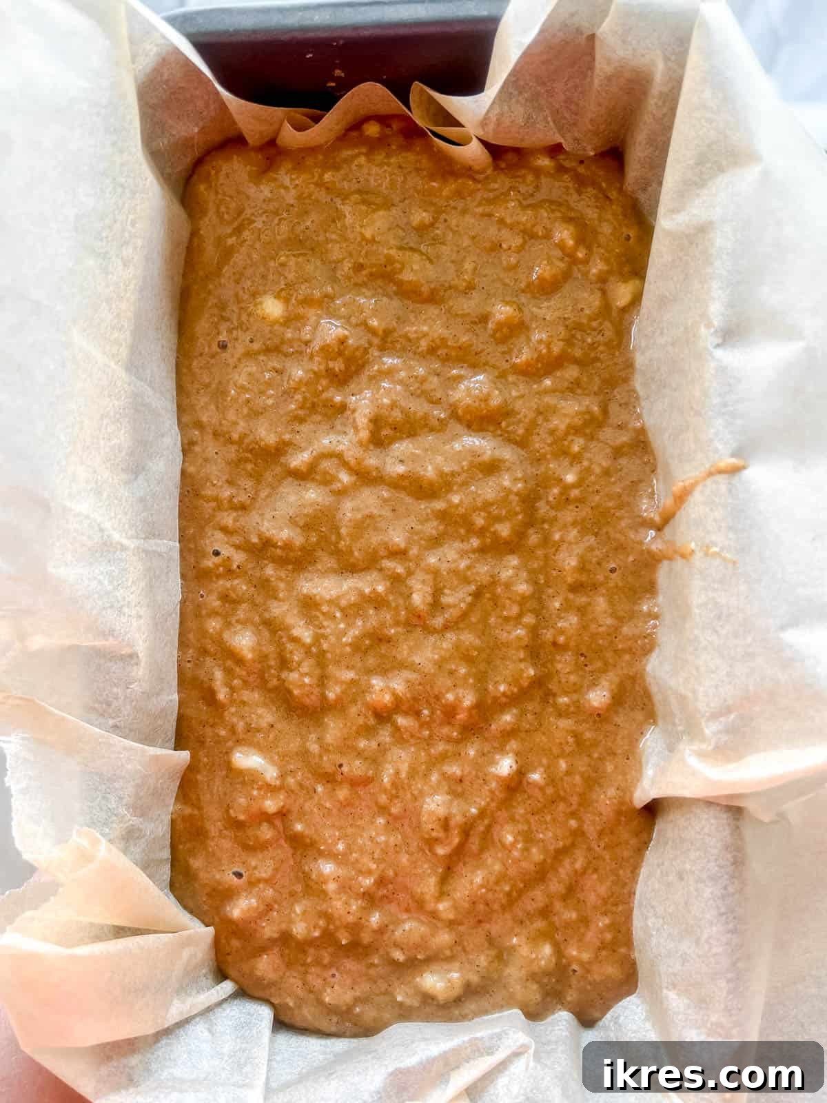 Paleo Banana Bread Grain and Dairy Free 9 Paleo banana bread batter poured into a prepared loaf pan.