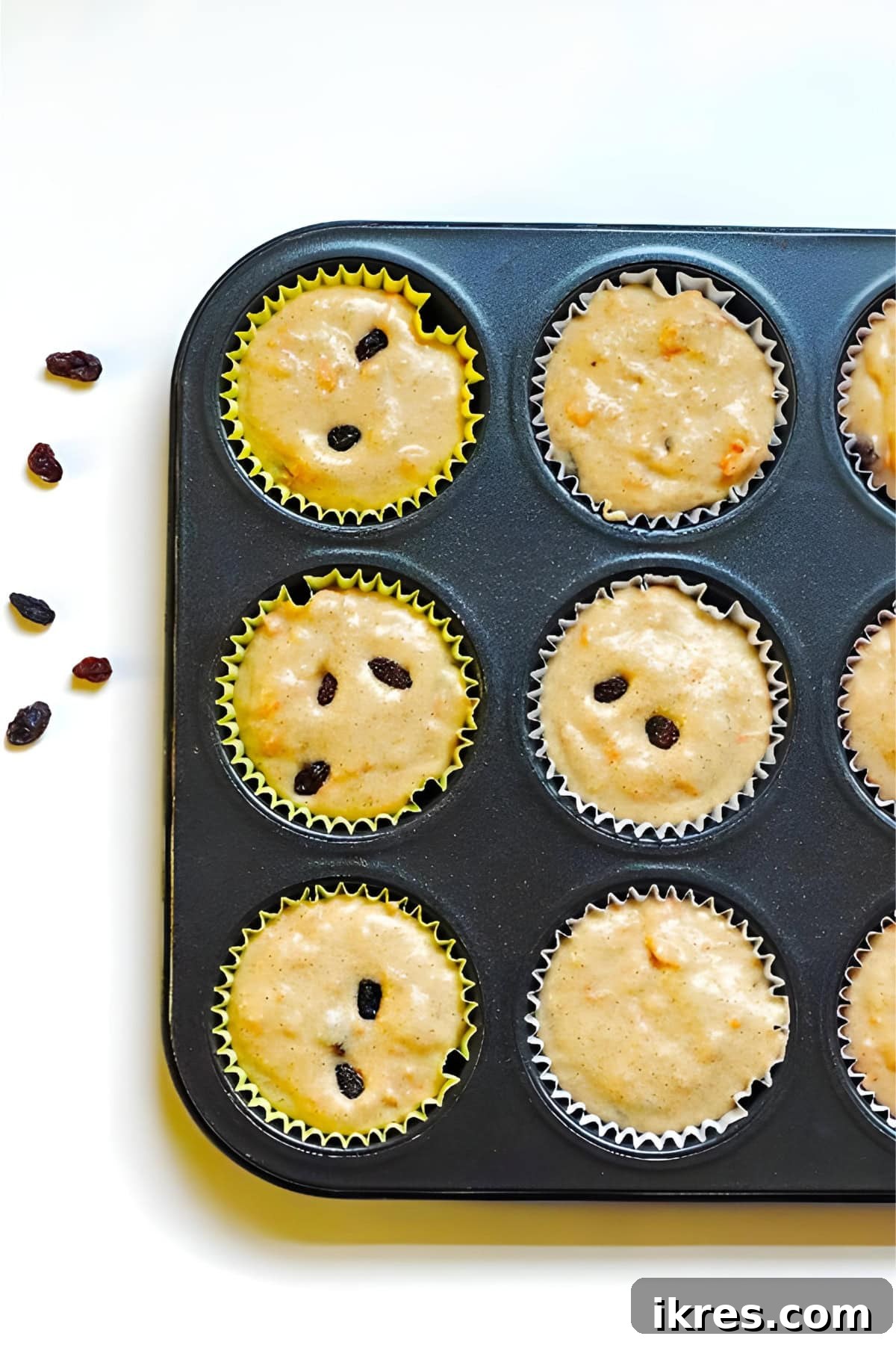 Perfectly Spiced Carrot Cake Muffins with Cream Cheese Glaze 5 Muffin cups filled with the batter