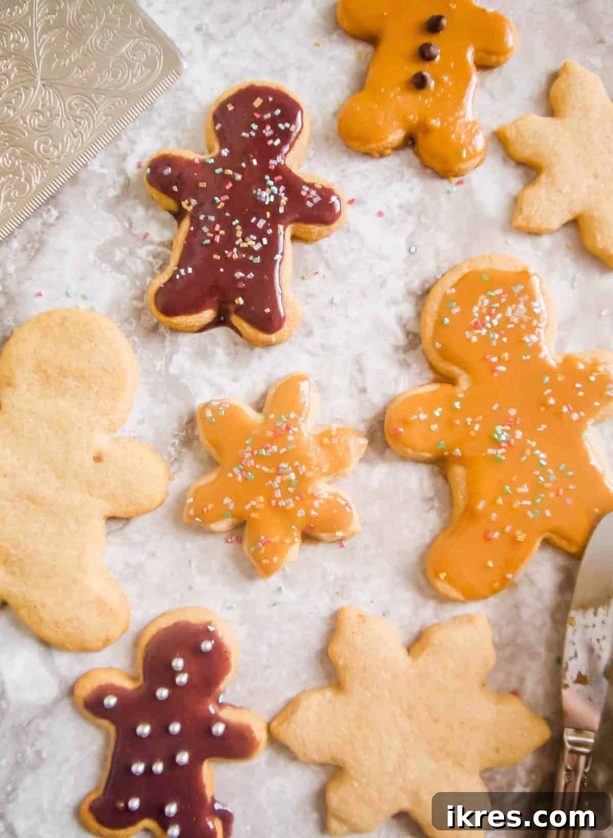 Freshly baked maple cut-out cookies arranged on a table, ready for frosting or serving.