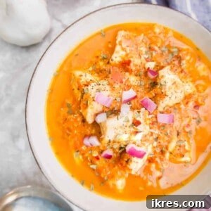 Cherry Tomato Sauce with Chicken in a bowl with onions on top.