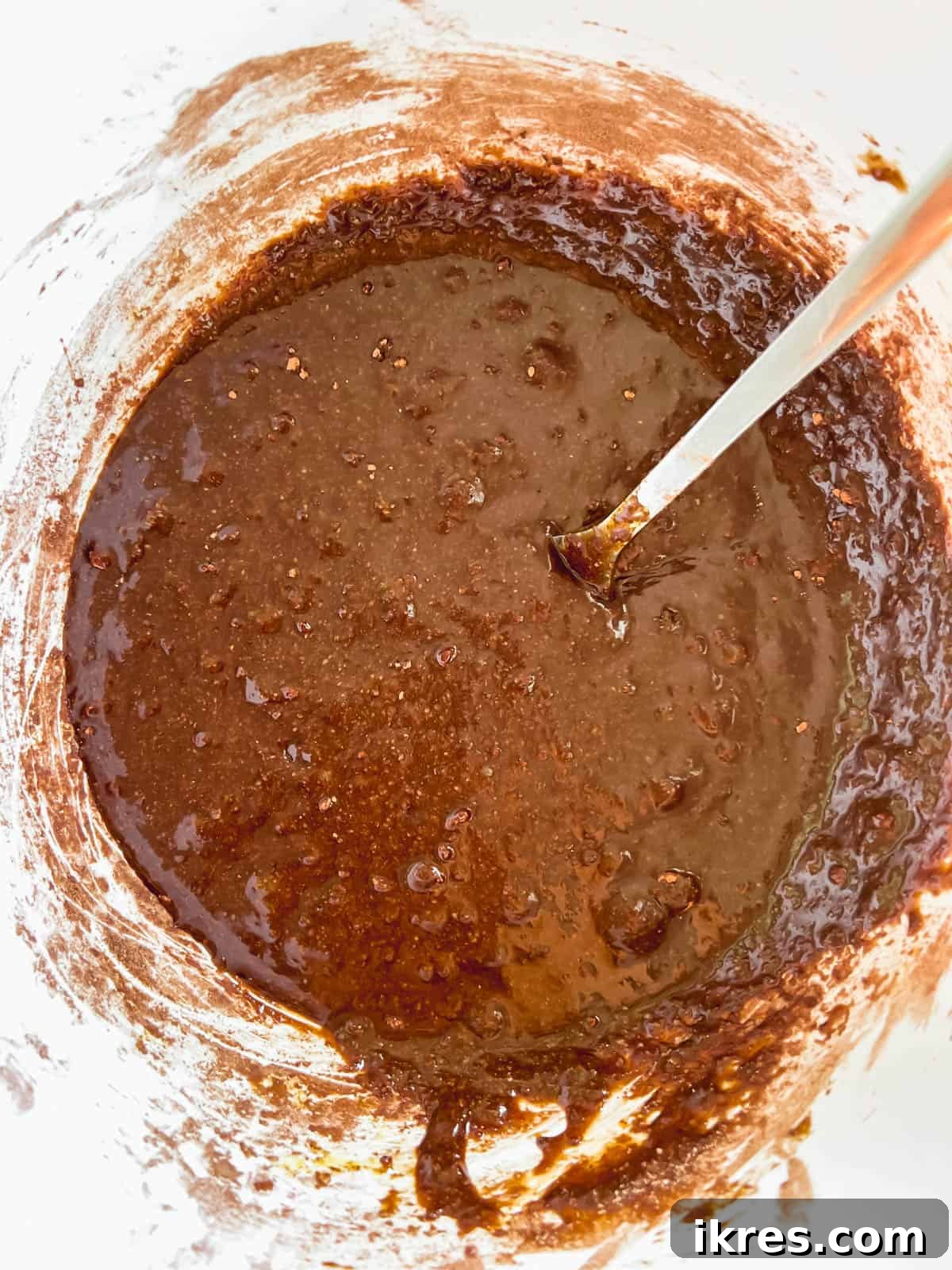 Smooth, rich brownie batter in a mixing bowl, ready for baking.