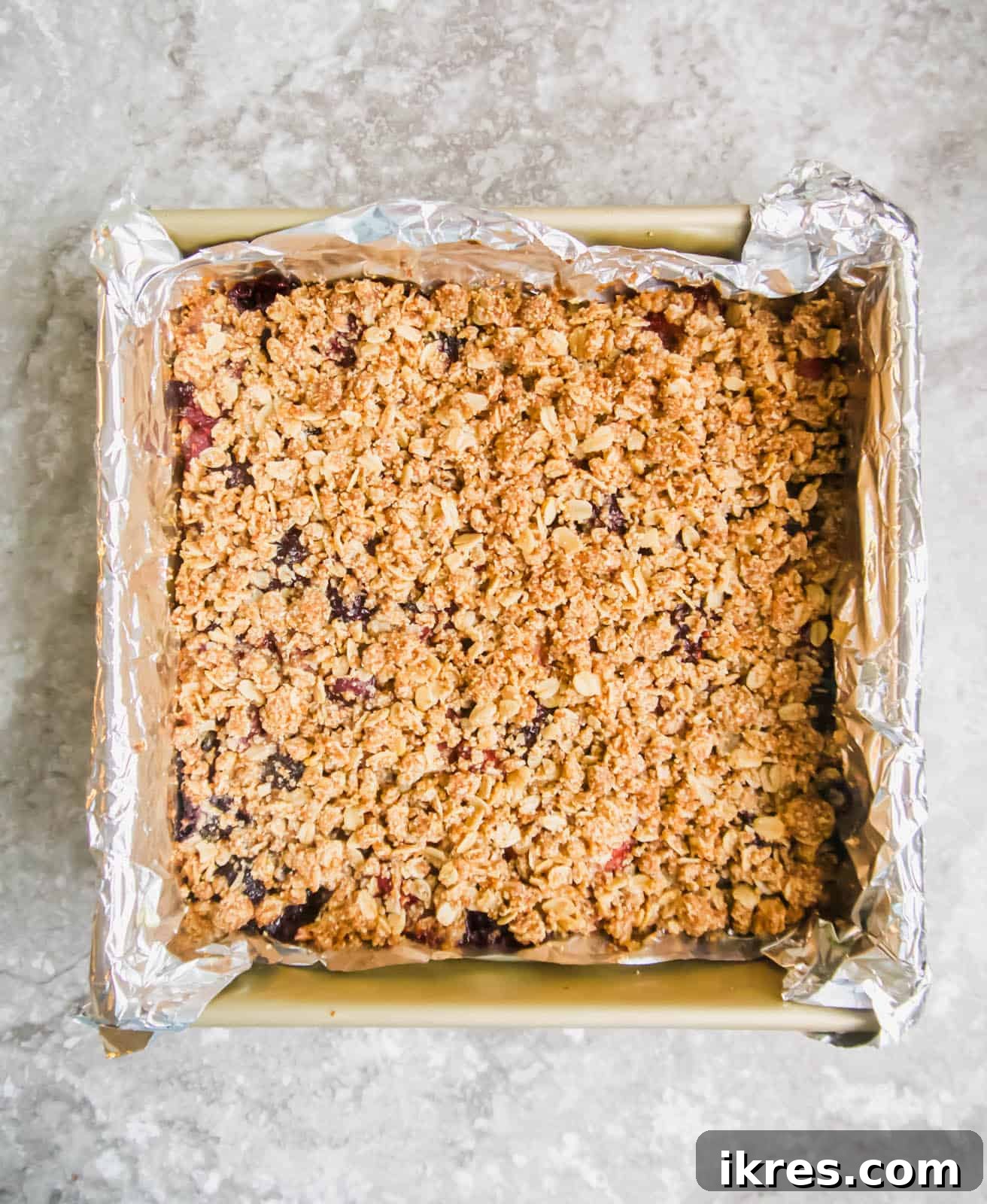 Delicious Gluten-Free Dairy-Free Berry Oat Bars 8 Freshly baked healthy oatmeal berry bars, golden and bubbling.