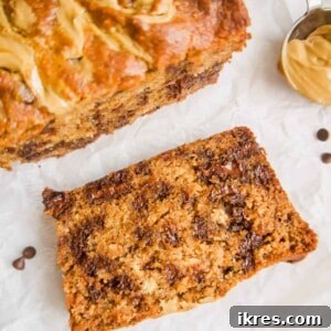 A slice of Paleo Banana Bread with Sunflower Butter and Chocolate Chips.
