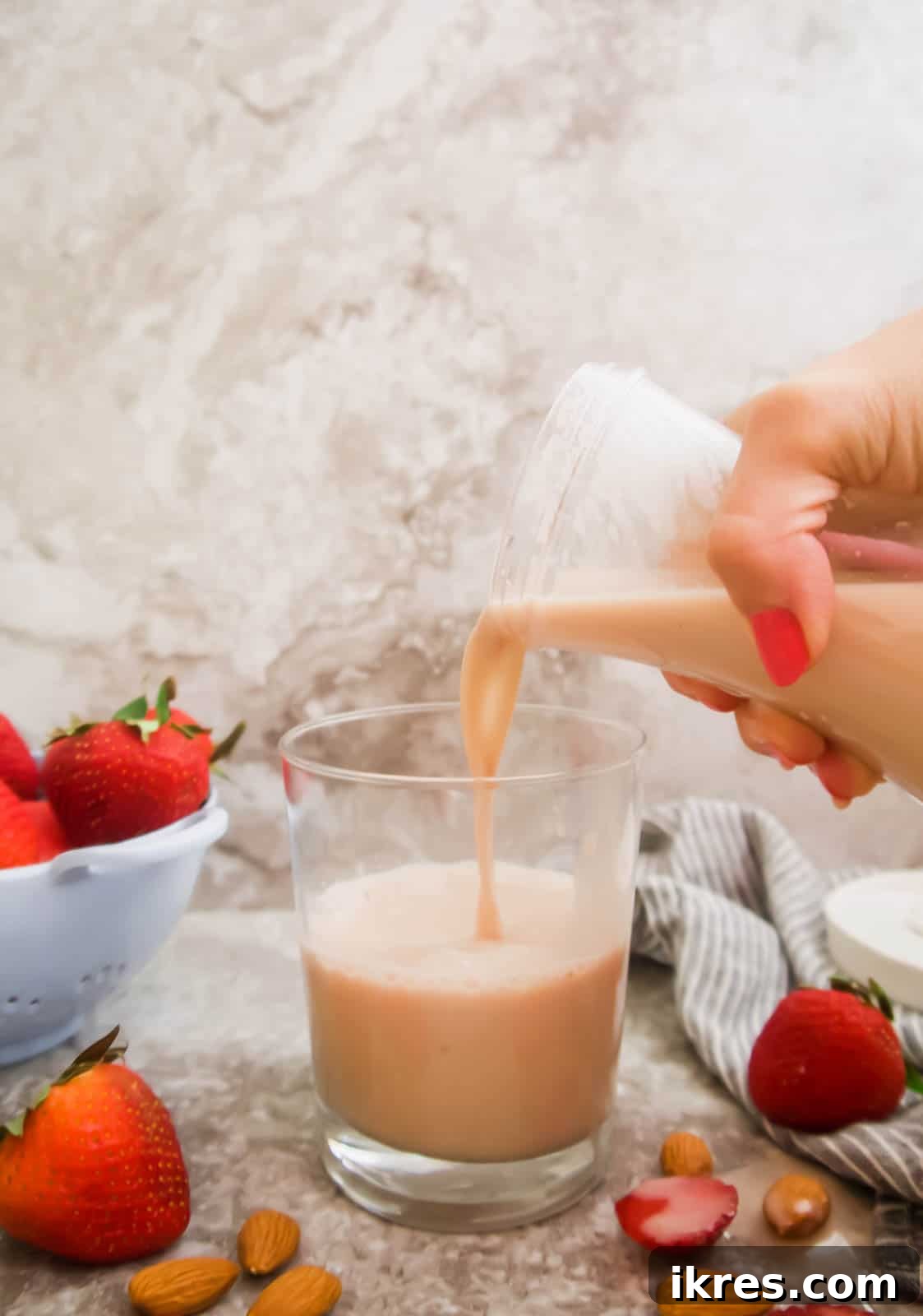 Homemade Vegan Strawberry Almond Milk 14 A glass of homemade strawberry almond milk ready to be served.