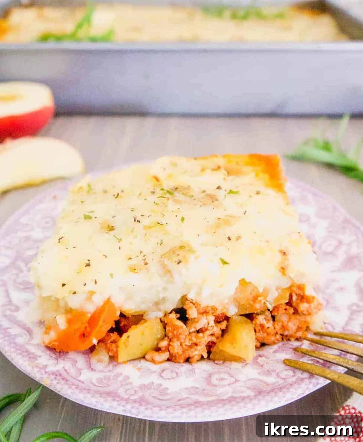 A beautifully plated slice of healthy shepherd's pie with ground turkey and apples, ready to be enjoyed.