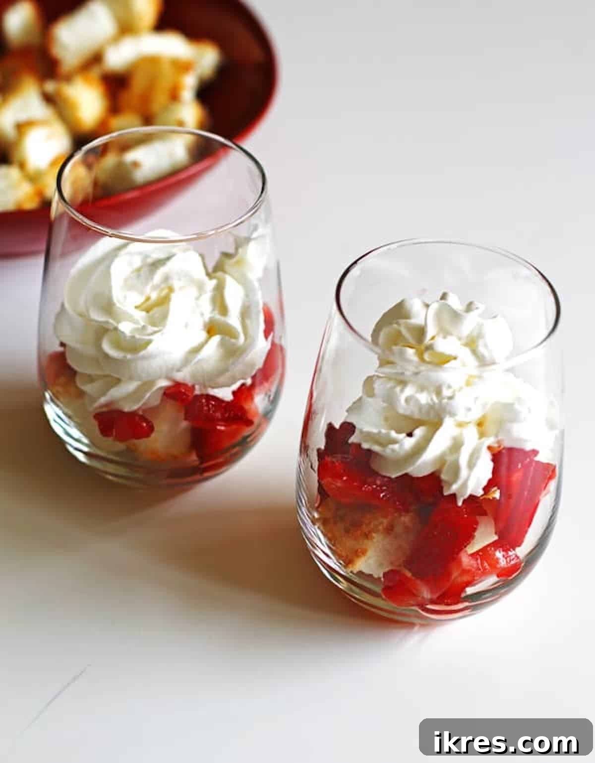Strawberry Angel Delight 12 Toasted angel food cake cubes topped with strawberries and whipped cream in a wine glasses to assemble strawberry shortcakes.