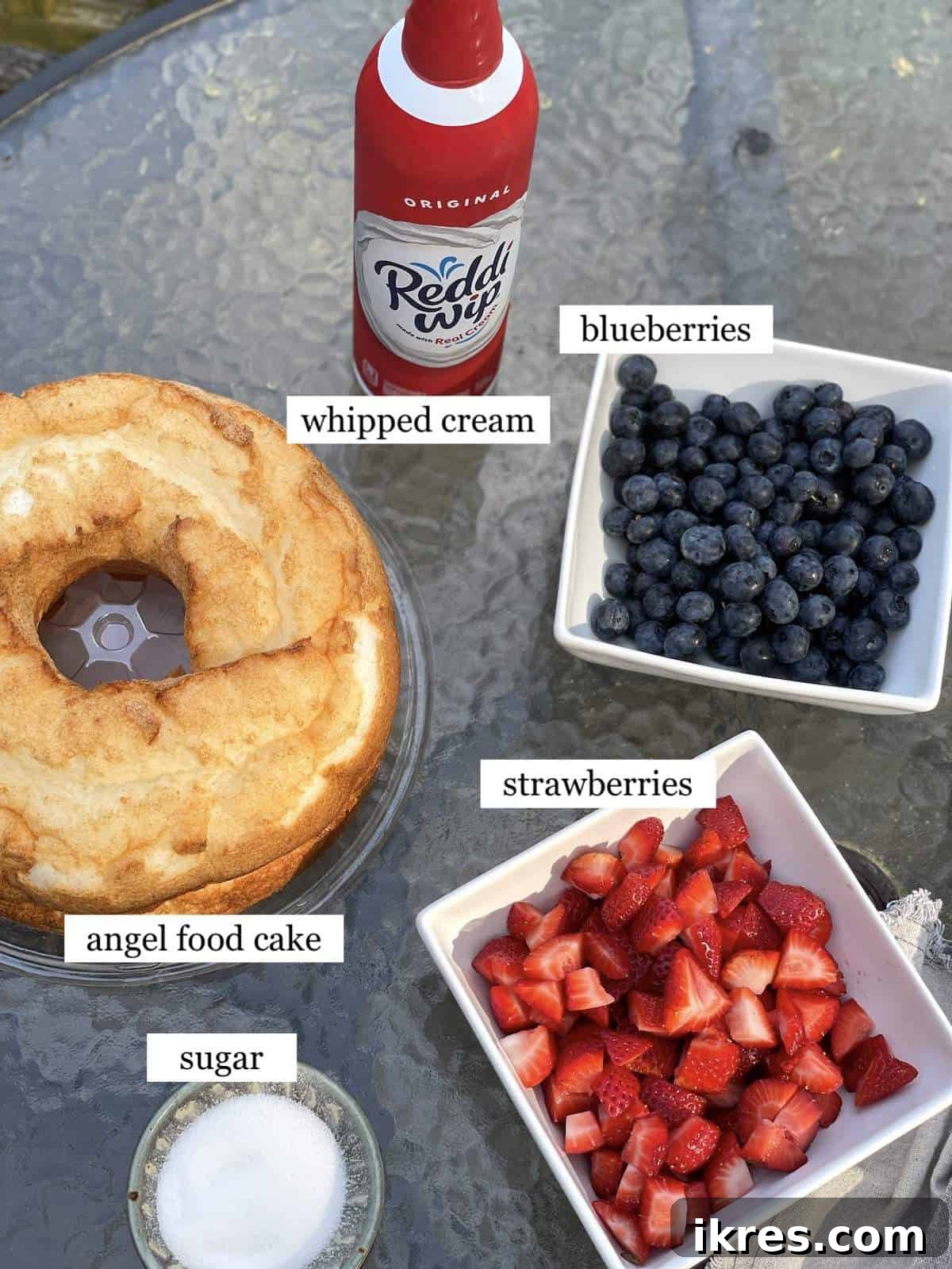 Strawberry Angel Delight 3 The ingredients in angel food cake strawberry shortcake laid out and labeled.