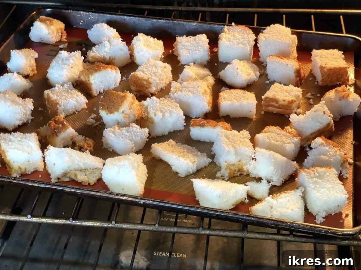 Strawberry Angel Delight 9 Angel food cake cubes toasting in the oven.